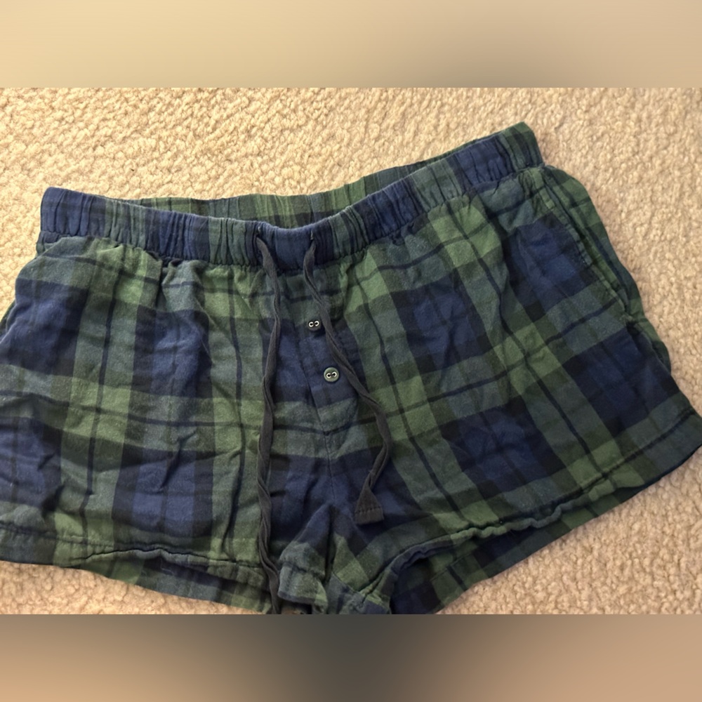 Stars above Blue and Navy Plaid Lounge Shorts. Women’s size small